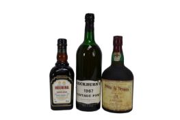 Three bottles, Cockburn's 1967 Vintage Port, Quinta da Mesquita tawny port and Heering Cherry Liqueu