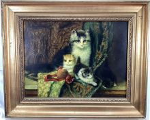 Continental School 20th century, oil on panel, A cat and her kittens on a rug, indistinctly signed.