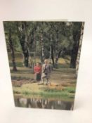 H.M. Queen Elizabeth II and H.R.H. The Duke of Edinburgh, signed 1984 Christmas card with gilt embos