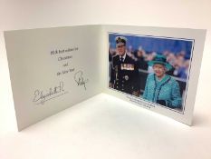 H.M. Queen Elizabeth II and H.R.H. The Duke of Edinburgh, signed 2014 Christmas card with twin gilt