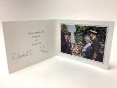 H.M. Queen Elizabeth II and H.R.H. The Duke of Edinburgh, signed 2004 Christmas card with twin gilt