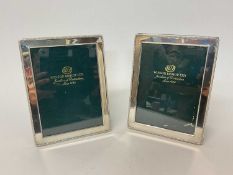 Pair of silver photo frames with beaded edges, retailed by Winsor Bishop