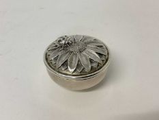Asprey silver box and cover, the cast silver lid with a sunflower and ladybird, made and retailed by