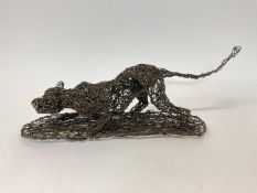 Contemporary wire work sculpture of a prowling big cat