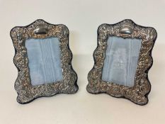 Pair of silver photo frames, decorated in relief
