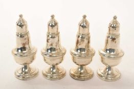 Set of four contemporary American Sterling silver casters of baluster form,