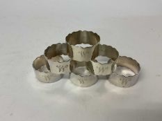 Set of six Mappin & Webb silver napkin rings with engraved initial 'W'