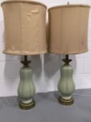 Two Large Porcelain table lamps in green with fixed silk shades, 107cm high, base width 20cm