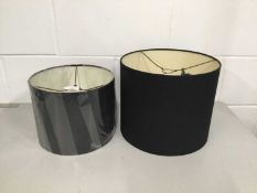 Two black drum lamp shades, 25.5cm and 20.5cm high