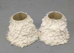 Pair of tapered lamp shades covered in white goose feathers, 31cm high
