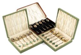 THREE CASED SETS OF SIX WHITE METAL TEA SPOONS, two sets with bamboo design stems and green