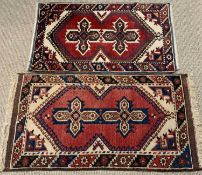 TWO TURKISH WOOLEN RUGS, red ground, near matching traditional motif central blocks, single bordered