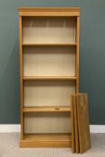 TALL LIGHT WOOD MODERN BOOKCASE, top light apertures, six interior adjustable shelves, plinth