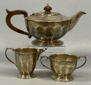 MAPPIN & WEBB THREE PIECE SILVER TEA SERVICE, comprising squat form tea pot, wood effect handle