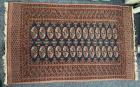 PERSIAN RED/BLUE GROUND HANDMADE WOOL RUG, multiple medallion centre, geometric border, 154 x 90cms
