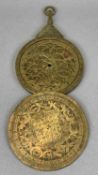 ARABIC BRASS CIRCULAR ASTROLABE, with Arabic script with four double sided dials, with suspension