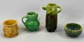 19TH CENTURY SLIP GLAZED TERRACOTTA TOBACCO JAR, with applied mask head decoration and inscribed 