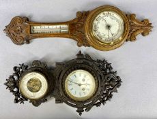 TWO VICTORIAN & LATER WALL BAROMETERS, comprising cast iron frame example with lower clock and upper