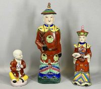 CHINESE STATUES (3), Earthenware figure of a Mandarin dignitary, colourful polychrome decoration,