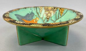 CARLTON WARE CIRCULAR TRI-FOOTED BOWL, printed, enamelled and gilded in the 