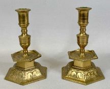 PAIR OF YSTAD METALL SWEDISH CAST BRASS CANDLESTICKS, with hexagonal mid column drip trays and domed