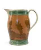 18TH C. CREAMWARE MOCHA JUG, c. 1790, swollen form with strap handle, decorated with dendritic