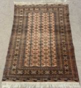 EASTERN RUG with repeating border and pattern, ground red and black, 188 x 125cms Provenance: