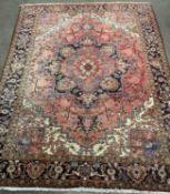 LARGE PERSIAN RUG of red ground with repeating border and central multiple diamond section, 345 x