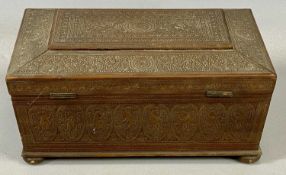 INDIAN SANDALWOOD TRINKET BOX, of sarcophagus form, profusely carved with birds, scrolls, flowers