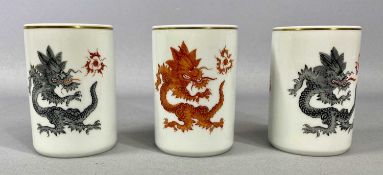 THREE MEISSEN 'LUCKY DRAGON' BRUSH POTS, gilded bands to rim, blue cross swords mark numbered