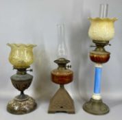 GROUP OF THREE OIL LAMPS, late 19th century & later, the first with embossed brass base, blue