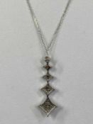 9CT WHITE GOLD DIAMOND SET PENDANT, modelled as five graduated stars, approx. 0.25ct total with fine