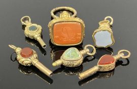 VARIOUS GOLD/GOLD TONE SEALS & WATCH KEYS, hardstone set Provenance: private collection