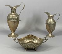 CYPRIOT SILVER GROUP OF THREE ITEMS, two pitchers and an oval two handled bowl, repousse decoration,