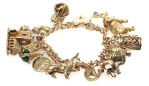 9CT GOLD CHARM BRACELET, curb link, heart padlock, with various mainly 9ct gold charms including