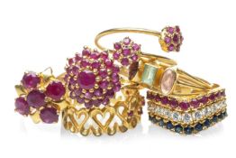 SIX YELLOW METAL DRESS RINGS, set with various gems including sapphire, rubies and white gem stones,