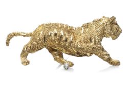 YELLOW METAL & DIAMOND TIGER BROOCH, modelled striding with ruby chip eyes, stamped '18K', 17g, 5.