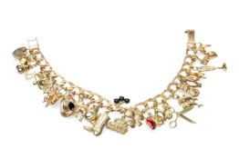 9CT GOLD FLAT CURB LINK CHARM BRACELET, with various mainly animal 9ct gold charms, heart padlock,