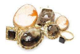 GROUP OF SMOKY QUARTZ JEWELLERY comprising three yellow metal set pendants (one stamped '22K'),