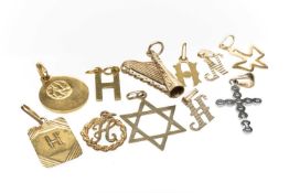 GROUP OF YELLOW METAL ATTACHMENTS, comprising six 9ct gold pendants, 9ct gold diamond cross pendant,
