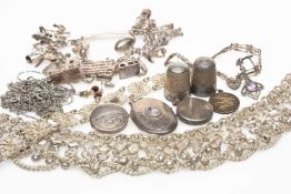 GROUP OF WHITE METAL JEWELLERY comprising silver charm bracelet, white metal filigree bracelet,