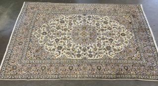 EASTERN KASHAN RUG, beige with multiple pattern border, 350 x 240cms Provenance: private