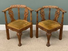 A PAIR OF CORNER CHAIRS in heavily carved oak, 79 (h) x 70 (w) x 70cms (d) Provenance: private