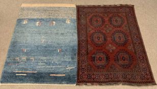 EASTERN WOOLLEN RUG, red ground with multiple border and central diamond pattern, 149 x 105cms and a