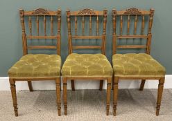SET OF THREE EDWARDIAN CHAIRS with carved and spindle backs and buttoned upholstered seats, 91 (h) x