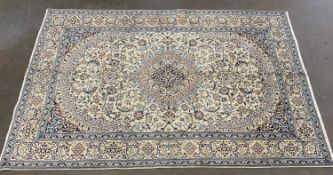 FINE NAIN EASTERN RUG, blue and cream ground with multiple border pattern, 292 x 197cms