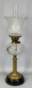 19TH CENTURY OIL LAMP, black ceramic base, reeded brass column, circular cut glass reservoir, twin
