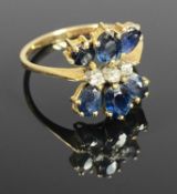 14CT GOLD RING set with six sapphires and three diamonds in a butterfly setting, sapphires approx.