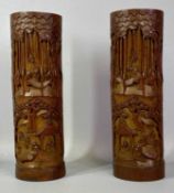 CHINESE CARVED BAMBOO VASES a pair, 19th century, carved with scenes of figures amongst bamboo trees