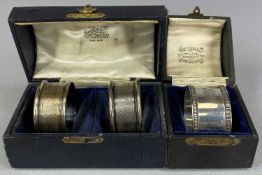 CASED PAIR OF SILVER NAPKIN RINGS engine turned decoration, George Unite and a cased single silver